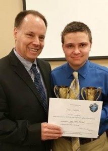 Receiving gold cup trophies and a certificate for taking first place in the Biological Science category at the Kilgore Regional Science Fair is North Lamar Freshman Josh Fulton (right).