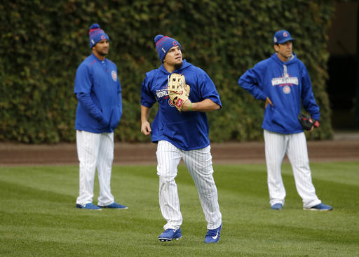 Chicago Cubs' Kyle Schwarber works out in the outfield during batting practice for Game 3 of the Major League Baseball World Series against the Cleveland Indians, Thursday, Oct. 27, 2016, in Chicago. (AP Photo/Charles Rex Arbogast)