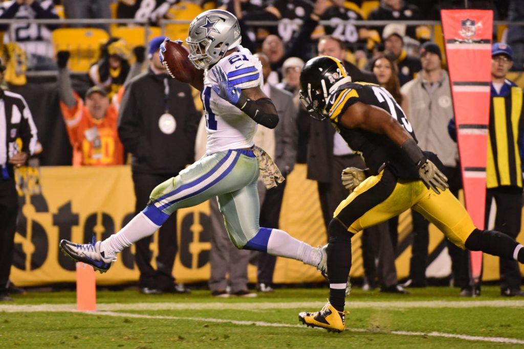 Dallas Cowboys running back Ezekiel Elliott (21) dances into the end zone ahead of Pittsburgh Steelers free safety Mike Mitchell (23) for the game winning touchdown during the second half of an NFL football game in Pittsburgh, Sunday, Nov. 13, 2016. The Cowboys won 35-30. (AP Photo/Fred Vuich)